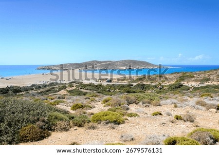 Breathtaking panoramic shot of Prasonisi, a unique sandbar where the Aegean and Mediterranean seas meet on the Greek island of Rhodes. A famous destination for watersports.