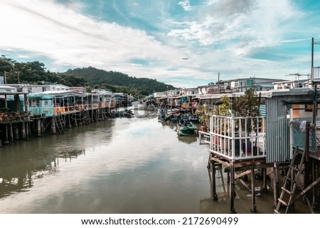 A breathtaking scenery of Tai O fishing village in Hong Kong. Boats and shacks could be found together.