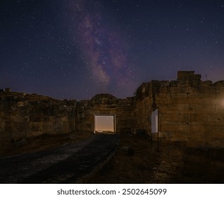 A breathtaking shot of the Milky Way stretching across the night sky above the ancient ruins of Blaundus in Uşak, Turkey. The starry sky beautifully contrasts with the historic stone structures - Powered by Shutterstock