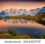 Breathtaking summer sunset on Lac Blanc lake with Mont Blanc (Monte Bianco) on background, Chamonix location. Calm outdoor scene of Vallon de Berard Nature Preserve, Graian Alps, France.