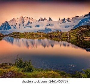 Breathtaking summer sunset on Lac Blanc lake with Mont Blanc (Monte Bianco) on background, Chamonix location. Calm outdoor scene of Vallon de Berard Nature Preserve, Graian Alps, France.