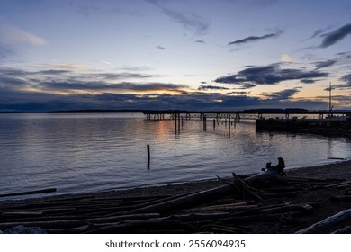 A breathtaking sunrise over the serene waters of Sidney Harbor. The sky colors reflect on the calm waters, creating a peaceful and picturesque scene on Vancouver Island, BC, Canada. - Powered by Shutterstock