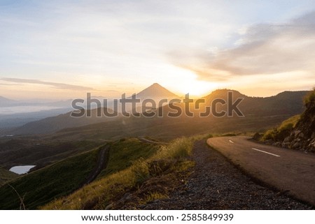 Similar – Image, Stock Photo Misty sunrise over winding road in La Mancha, Spain