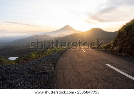 Similar – Image, Stock Photo Misty sunrise over winding road in La Mancha, Spain