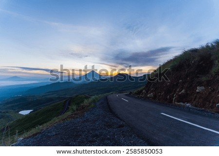 Similar – Image, Stock Photo Misty sunrise over winding road in La Mancha, Spain