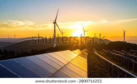 A breathtaking sunset illuminates a landscape featuring both solar panels and wind turbines, symbolizing sustainable energy production.