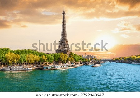 Breathtaking sunset panorama of the Eiffel Tower, bridges, and Seine River in Paris, France