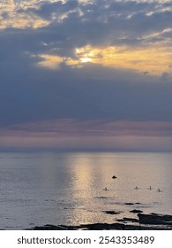 A breathtaking sunset with sufboards in the background