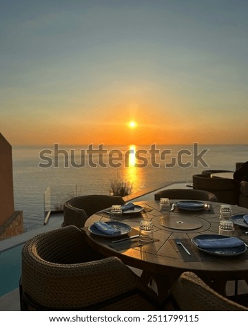 A breathtaking sunset view from Sunset Utopia on Lefkada, with vibrant colors lighting up the sky as the sun sets over the tranquil waters.