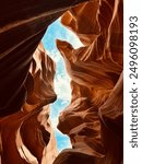 Breathtaking view of Antelope Canyon in Arizona, showcasing its stunning sandstone formations, narrow passageways, and mesmerizing light beams filtering through the canyon.