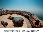 Breathtaking view of the Dead Sea from a scenic overlook in Jordan during a sunny day surrounded by rocky terrain