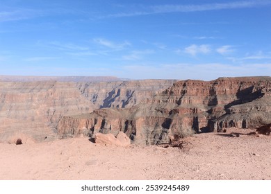 A breathtaking view of the Grand Canyon's vibrant rock formations set against a clear blue sky, capturing natural beauty and serene landscapes in one of America's most famous landmarks. - Powered by Shutterstock