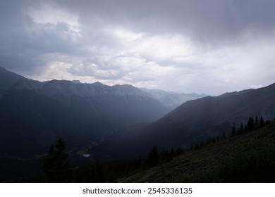 Breathtaking View from Ha Ling Trail Overlooking Misty Mountain Peaks on a Rainy Day in Banff, Alberta, Canada – Moody and Atmospheric Landscape Photography - Powered by Shutterstock