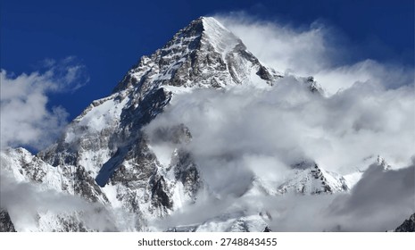 A breathtaking view of the legendary K2, the world’s second-highest mountain. This shot captures the formidable, snow-draped pyramid of the 