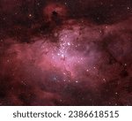 A breathtaking view of light red and pink Eagle Nebula in the constellation Serpens