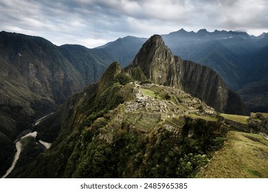 A breathtaking view of Machu Picchu, the ancient Incan city perched high in the Andes mountains, showcasing its intricate stone structures against a backdrop of lush green peaks. - Powered by Shutterstock