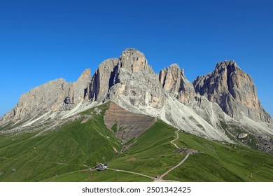 breathtaking view of the mountain group called Sassolungo in northern Italy in summer with very intense blue sky