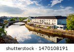 Breathtaking view on a bank of the River Nore in Kilkenny, one of the most beautiful town in Ireland. Warm summer evening.