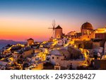 Breathtaking view over Oia village in Santorini island at sunset. Santorini, Cyclades in Greece.
