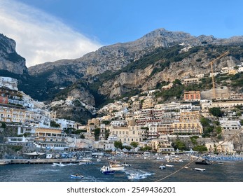 Breathtaking View of Positano Village with Colorful Cliffside Homes, Azure Waters, and Majestic Mountain Backdrop - Powered by Shutterstock