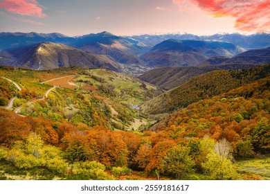 A breathtaking view of the Pyrenees in autumn, showcasing vibrant foliage, winding mountain roads, lush valleys, and dramatic skies, blending natural beauty with seasonal colors. - Powered by Shutterstock