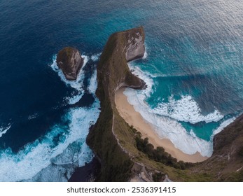 A breathtaking view of a secluded beach surrounded by dramatic cliffs and turquoise ocean waves. - Powered by Shutterstock