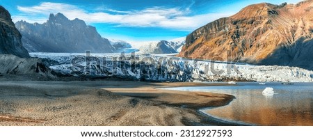 Breathtaking view of Skaftafellsjokull glacier tongue and volcanic mountains around on South Iceland. Location Skaftafell National Park, Skaftafellsjokull glacier, Iceland, Europe.