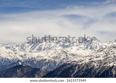 breathtaking view of snowcap mountain range with bright sky