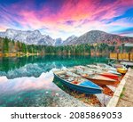 Breathtaking view of sunset over Fusine lake with Mangart peak on background. Popular travel destination of Julian Alps. Location: Tarvisio comune , Province of Udine, Italy, Europe