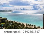 Breathtaking View of Tumon Bay with Clear Blue Waters and Palm Trees in Guam