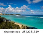 Breathtaking View of Tumon Bay with Clear Blue Waters and Palm Trees in Guam