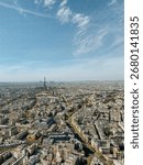 Breathtaking wide-angle view of Paris with the Eiffel Tower majestically framed in the background, symbolizing the city