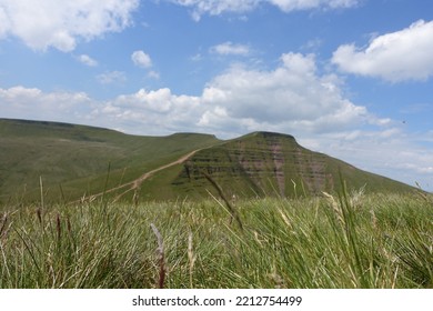 Brecon Beacons Horseshoe Ridge In The Fields Views Of The Mountains. Summer Day With Clouds In The Sky.