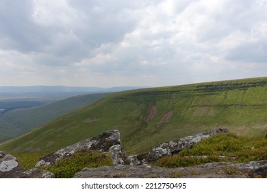 Brecon Beacons Horseshoe Ridge Walk, Wales On A Cloudy Day. Path Running Up The Side Of The Mountain 