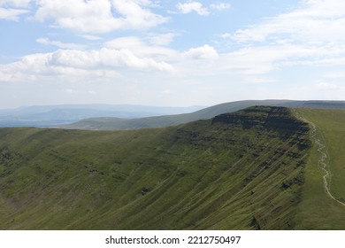 Brecon Beacons Horseshoe Ridge Walk, Wales On A Cloudy Day. Path Running Up The Side Of The Mountain 