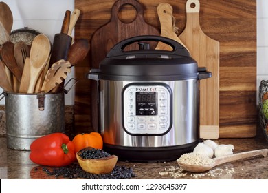 Breeding, KY, USA - January 08, 2019: Instant Pot pressure cooker on kitchen counter with beans and rice.