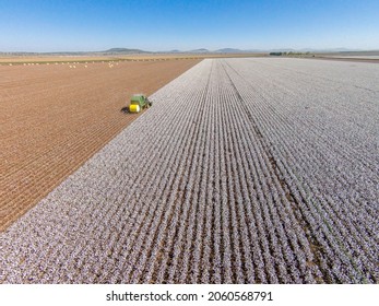 Breeza, Australia - May 6, 2015. An aerial photograph of a cotton harvester baling cotton.