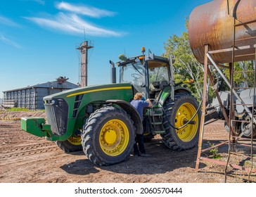 Breeza, Australia - May 6, 2015. A tractor being refuelled on a farm.