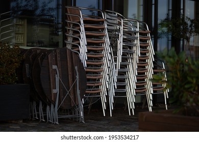 Bremen, Germany - 12 04 2020: Furniture (stools, Tables) Of A Closed Outside Area Of A Café Restaurant During Corona Lockdown In Germany