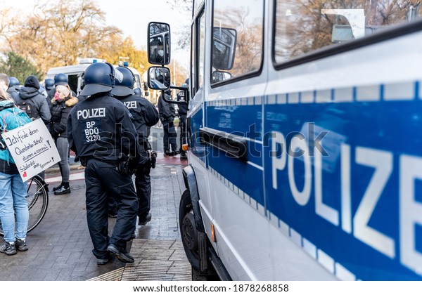 Bremen, Germany-05.12.20: Riot Police\
is standing on the side of a political rally or demonstration\
against the corona laws of the german\
government.