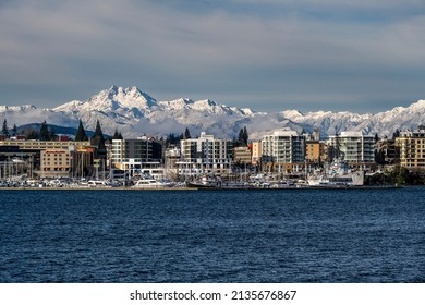 Bremerton, Washington, USA - January 2, 2022: City skyline with snowy mountains of the Olympic peninsula on backdrop