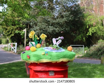Brentwood, Essex, UK - April 17 2022: post box decorated with crocheted Easter topper created by the Random Acts of Crochet Kindness group