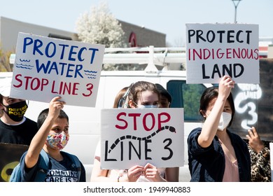 BRENTWOOD, MO.- April 3, 2021: Local Activists Hold Signs At A Protest Of Enbridge Energy's Line 3 Pipeline Expansion Project That Threatens The Ecology Of Protected Indigenous Lands And US Waterways.