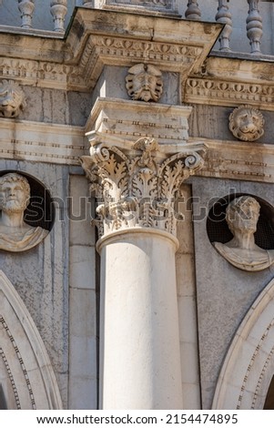 Brescia downtown. Detail of the ancient Loggia Palace (Palazzo della Loggia) in Renaissance Style, 1492-1574, in Loggia town square (Piazza della Loggia). Lombardy, Italy, Southern Europe.