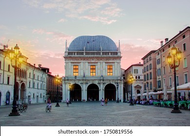 Brescia, Italy - 09 03 2018: Panoramic view of Loggia palace ( palazzo della loggia) of Brescia square during sunset at the end of the summer.