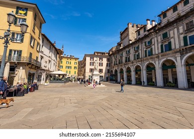 BRESCIA, ITALY - APRIL 17, 2022: Brescia downtown. Old town square called Piazza della Loggia of the Renaissance period with the marble statue of beauty Italy (Bella Italia), Lombardy, Italy, Europe.