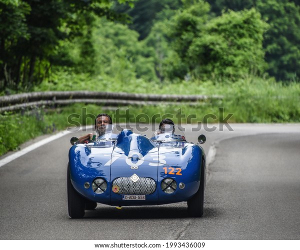 Brescia, Italy - June 16, 2021: A vintage 1945\
Citroen automobile rolls along Italian roads at the 2021 Mille\
Miglia, a 100-mile re-creation of the historic race from Brescia to\
Rome and back.