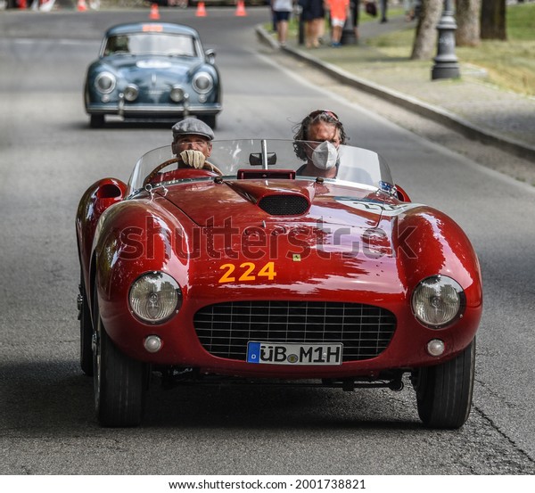Brescia, Italy - June 16, 2021: A 1953 Ferrari\
Spider Pinin Farina in the opening miles of the 2021 Mille Miglia,\
a 100-mile re-creation of the historic auto race from Brescia to\
Rome and back.