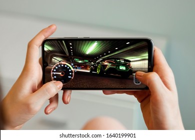 Brest, Belarus, January 31, 2020: Mobile game Need For Speed no Limits on a close-up of the screen of the Xiaomi Redmi Note 8 smartphone. A person plays a game on a smartphone - Shutterstock ID 1640199901