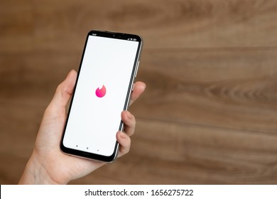 Brest, Belarus, January 31, 2020: Logo of the tinder application on a close-up of the screen of the Xiaomi Redmi Note 8 smartphone. Tinder application. Social network